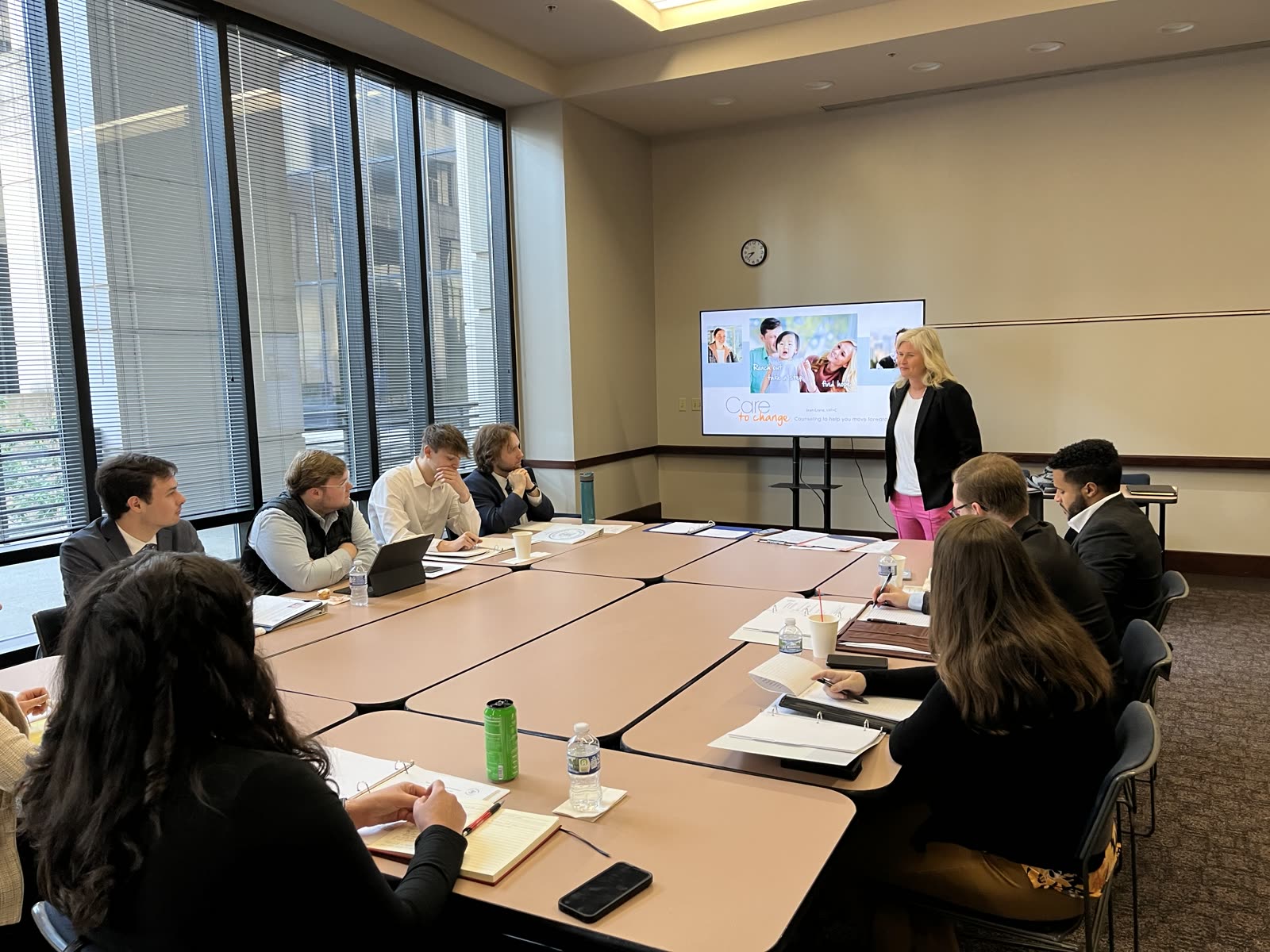 A leadership discussion around a boardroom table.